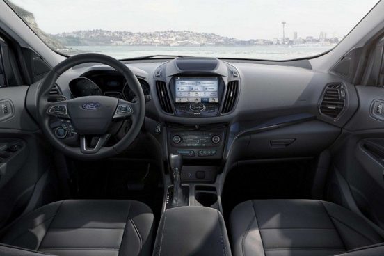 Image of the inside of a 2019 Ford Escape parked in front of the water.