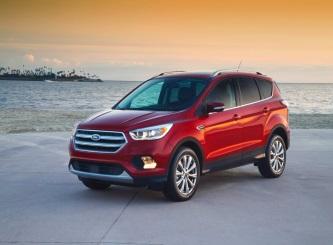 Image of a red 2017 Ford Escape parked by the water.