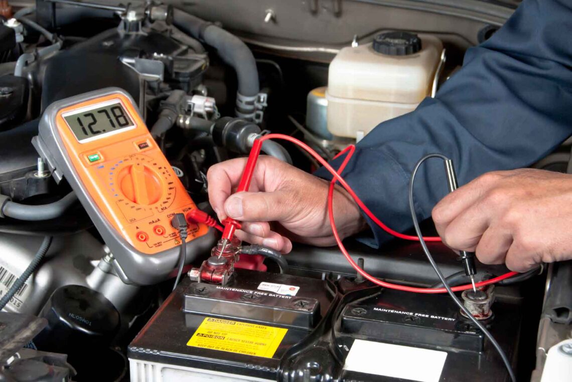 Ford service technician testing a battery