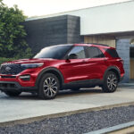 A used Ford model parked in a driveway