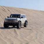 The 2026 Ford Bronco on a sandy dune