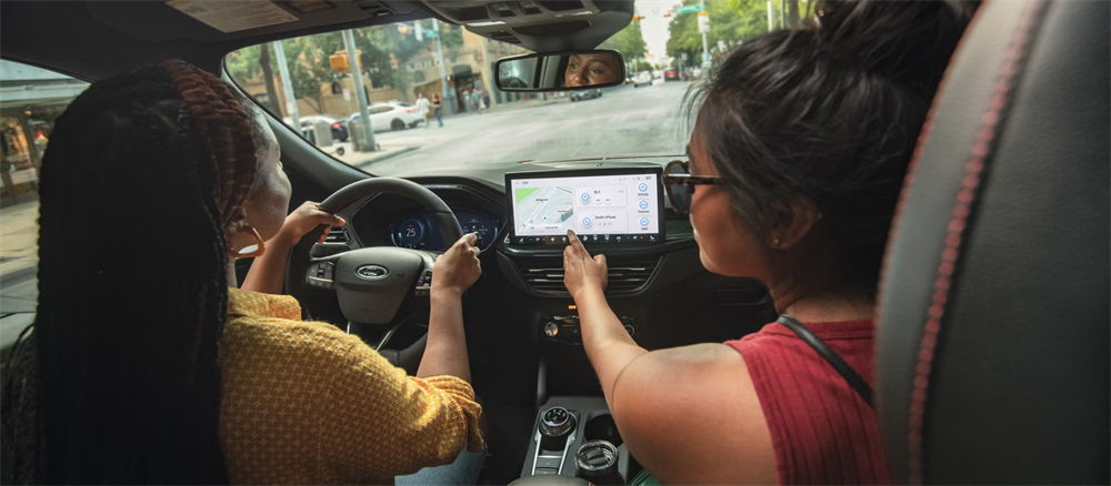 Student car lease drivers inside a 2026 Ford Escape